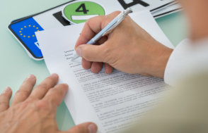 man filling up documents