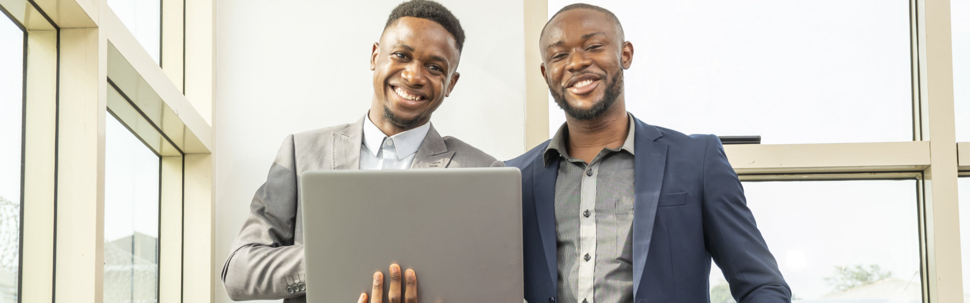 two professionals smiling